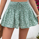 VCAY Shorts de pierna ancha para mujeres con cintura alta de estilo de vacaciones, corte holgado, cinturon anudado y estampado floral pequeno.