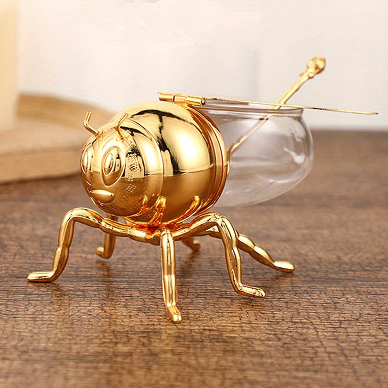 Tarro de Miel con Forma de Abeja Lujoso - Frasco Metálico Dorado y Vidrio con Tapa Articulada y Cuchara, Almacenamiento Decorativo para Miel, Especias, Azúcar, Té - Estilo Vintage para Mesa, 14x9.6x8 cm