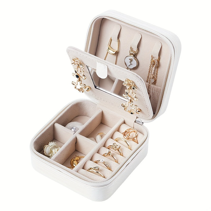 Un elegante y creativo joyero portátil para anillos y pendientes, con una cremallera y una tapa abatible para facilitar su transporte. Este estuche de viaje incluye un espejo y está diseñado para collares, pendientes y anillos, joyeros.