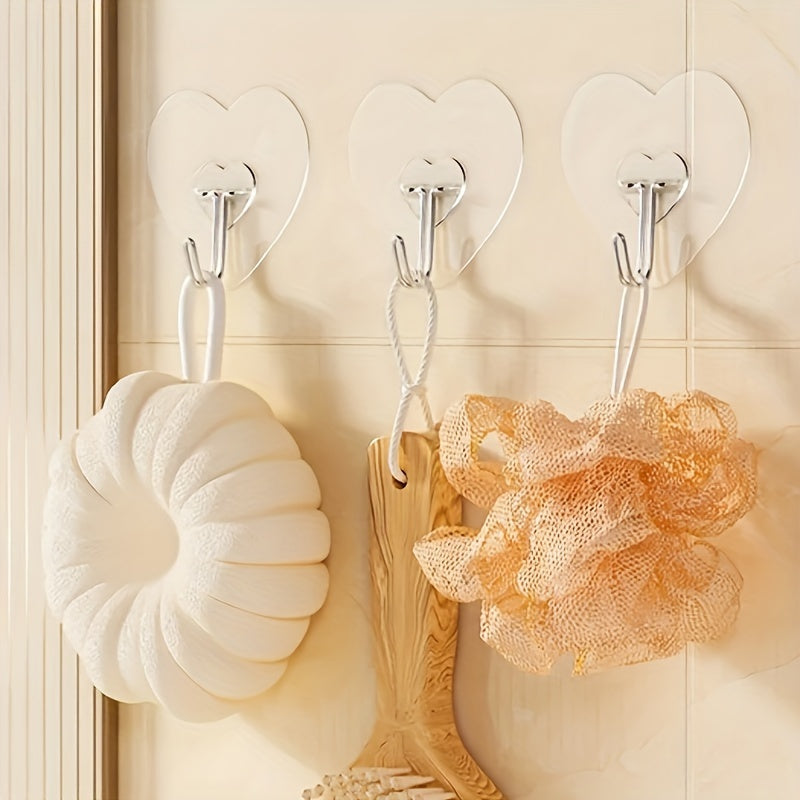 10 ganchos adhesivos grandes y resistentes, copas de succión transparentes sin taladro, soportes para pared en forma de corazón reforzados para almacenamiento en cocina y baño, fácil instalación, estilo casual, ganchos utilitarios