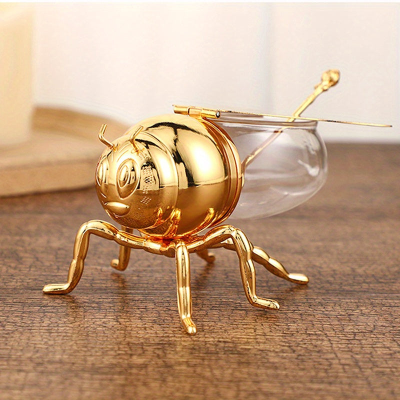 Tarro de Miel con Forma de Abeja Lujoso - Frasco Metálico Dorado y Vidrio con Tapa Articulada y Cuchara, Almacenamiento Decorativo para Miel, Especias, Azúcar, Té - Estilo Vintage para Mesa, 14x9.6x8 cm