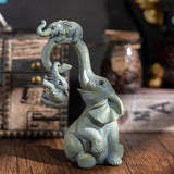 Un conjunto decorativo de figuritas de madre y elefante, perfecto para regalos del Día de la Madre.