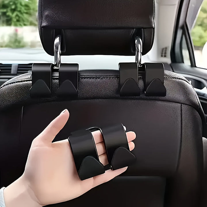 2 piezas de gancho multiusos para respaldo de asiento de coche - Gancho doble para almacenamiento de cinturones de seguridad, cojines de cabeza y accesorios, duradero plástico ABS negro, se adapta a la mayoría de los vehículos, organizador de cinturones