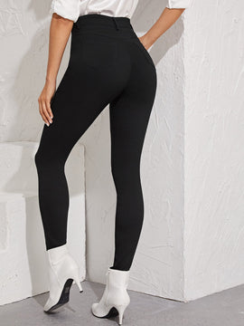 Essnce Jeggings ajustados con boton con lavado negro
