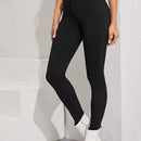 Essnce Jeggings ajustados con boton con lavado negro