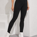 Essnce Jeggings ajustados con boton con lavado negro