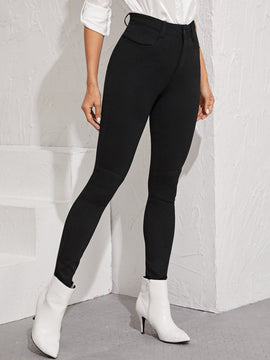 Essnce Jeggings ajustados con boton con lavado negro