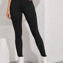 Essnce Jeggings ajustados con boton con lavado negro