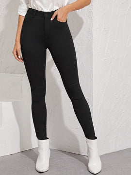 Essnce Jeggings ajustados con boton con lavado negro