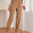 Prive Pantalones conicos con nudo de cintura con volante