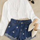 Shorts en mezclilla con bordado floral
