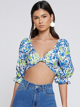 Top girante delantero fruncido trasero floral