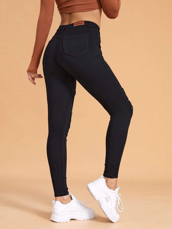 Essnce Pantalones ajustados rasgados de alta elasticidad