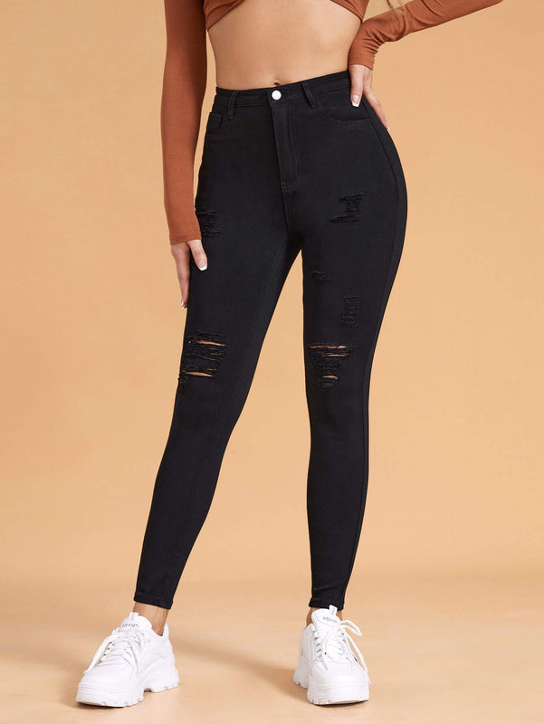Essnce Pantalones ajustados rasgados de alta elasticidad