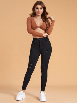 Essnce Pantalones ajustados rasgados de alta elasticidad