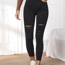 Essnce Pantalones ajustados rasgados de extremo alto