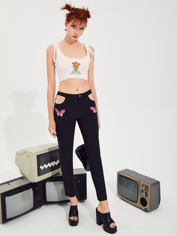 Pantalones con estampado de mariposa con abertura