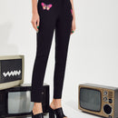 Pantalones con estampado de mariposa con abertura