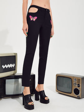 Pantalones con estampado de mariposa con abertura