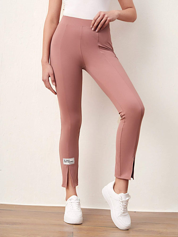 Mulvari Pantalones con diseno de parche de letra bajo con abertura
