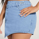 PETITE Skort mezclilla bajo asimetrico con boton delantero