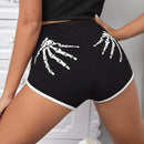 SXY Shorts estampado de esqueleto unido en contraste
