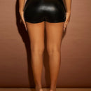 SXY Skort con diseno de tachuela bajo asimetrico PU