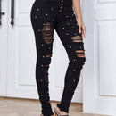 Jeans ajustados desgarro con cuenta de perla