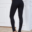 Jeans ajustados desgarro con cuenta de perla