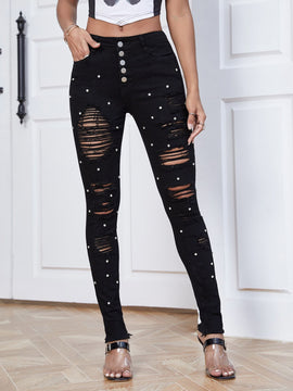 Jeans ajustados desgarro con cuenta de perla