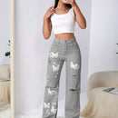 Jeans con lavado con diseno de desgarro con mariposa