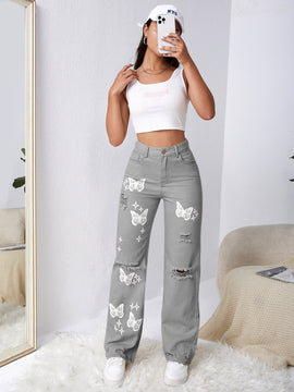 Jeans con lavado con diseno de desgarro con mariposa