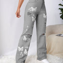 Jeans con lavado con diseno de desgarro con mariposa
