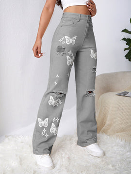 Jeans con lavado con diseno de desgarro con mariposa
