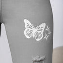 Jeans con lavado con diseno de desgarro con mariposa