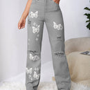 Jeans con lavado con diseno de desgarro con mariposa