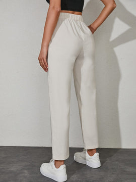 Pantalones unicolor con bolsillo oblicuo de cintura con cordon