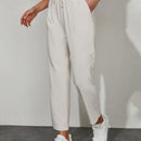 Pantalones unicolor con bolsillo oblicuo de cintura con cordon