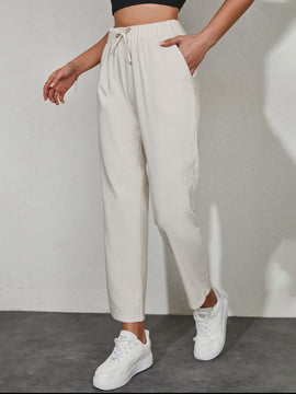 Pantalones unicolor con bolsillo oblicuo de cintura con cordon