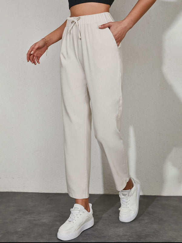Pantalones unicolor con bolsillo oblicuo de cintura con cordon