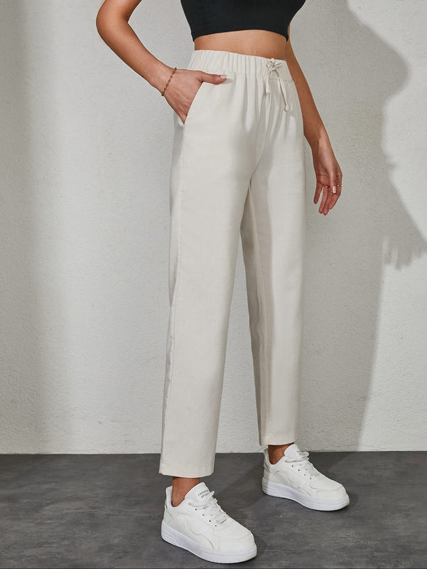 Pantalones unicolor con bolsillo oblicuo de cintura con cordon
