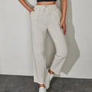Pantalones unicolor con bolsillo oblicuo de cintura con cordon