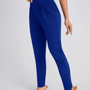 Pantalones ajustados unicolor con bolsillo oblicuo