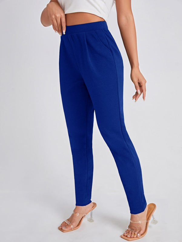 Pantalones ajustados unicolor con bolsillo oblicuo