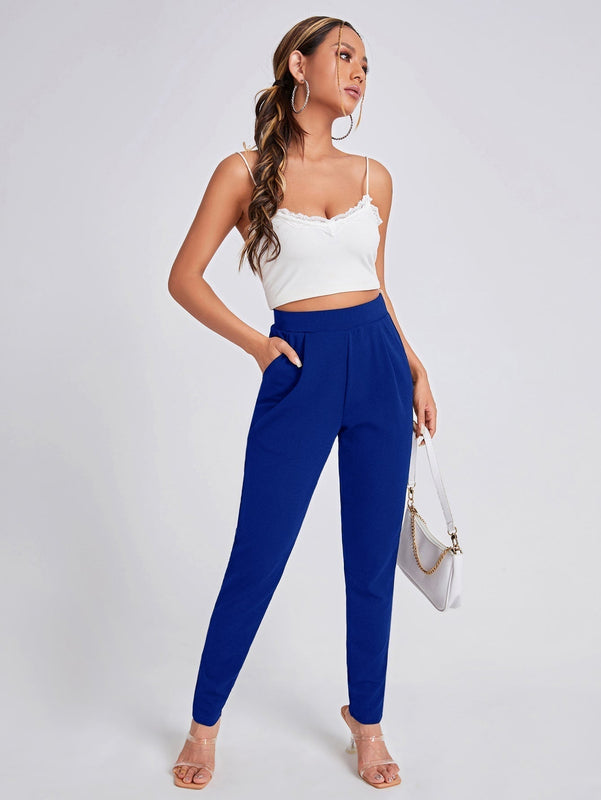 Pantalones ajustados unicolor con bolsillo oblicuo