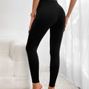 Pantalones ajustados de talle alto con diseno de boton