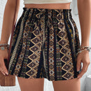 Shorts con estampado geometrico de cintura con volante con nudo delantero