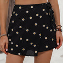 LUNE Skort con estampado floral de margarita con nudo lateral cruzado