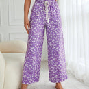 Pantalones largos con cintura con cordon y estampado floral
