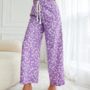 Pantalones largos con cintura con cordon y estampado floral